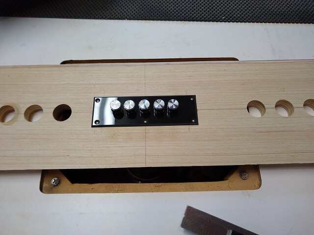 Marking the mounting holes for the audio panel.
