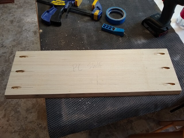 The shelf that will hold the PC in the back of the cabinet.