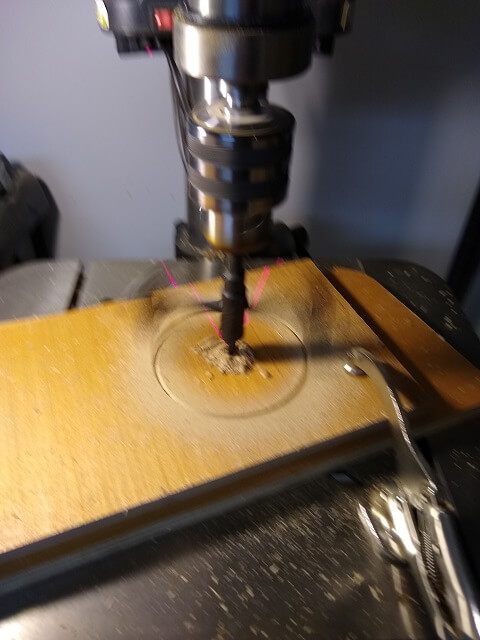 Using the hole cutting bit.