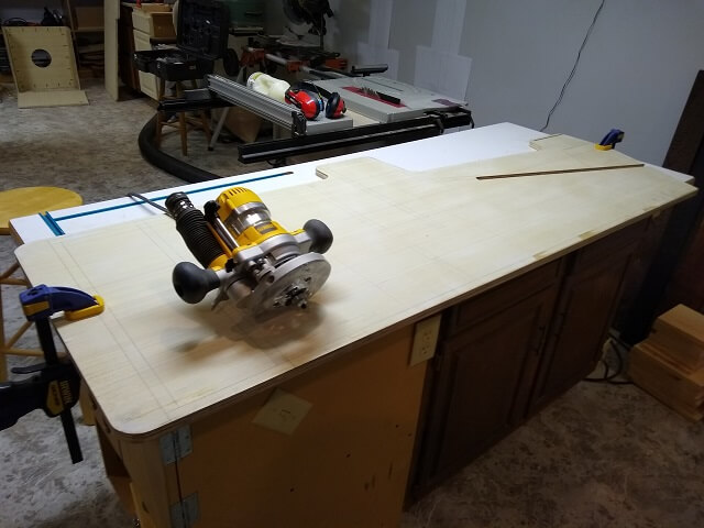 Routing the slot in the edges of the cabinet sides.