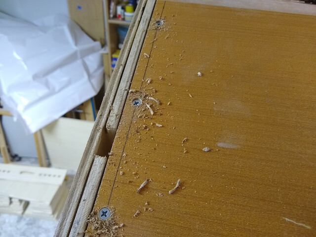 Countersinking screws on the top panel.
