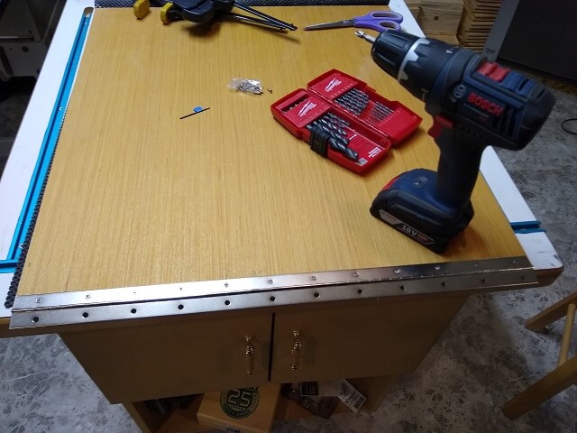 Mounting the piano hinge to the back panel door.