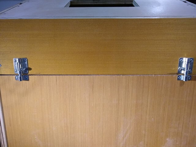 Mounting latches to the top of the back panel door.