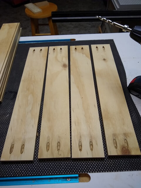 The pocket holes drilled in the drawer sides.