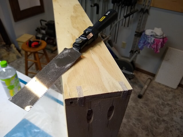 Splines trimmed flush with the drawer sides.