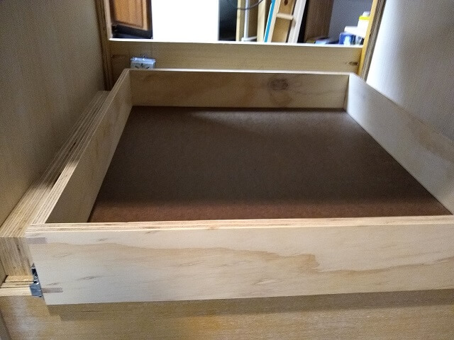 The bottom drawer sticking out with the electrical box in place.