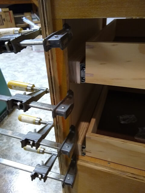 Attaching the hinge side face frame.