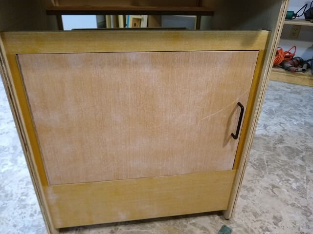 Test fitting the lower cabinet door.