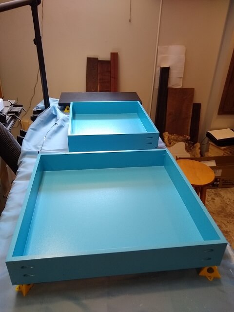 The drawers being painted.
