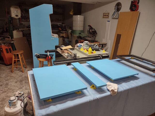 Painting more pieces of the cabinet.