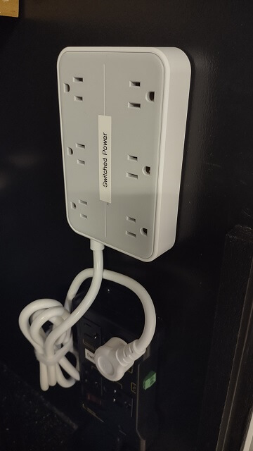 An auxiliary power strip that is plugged into the IOT relay.