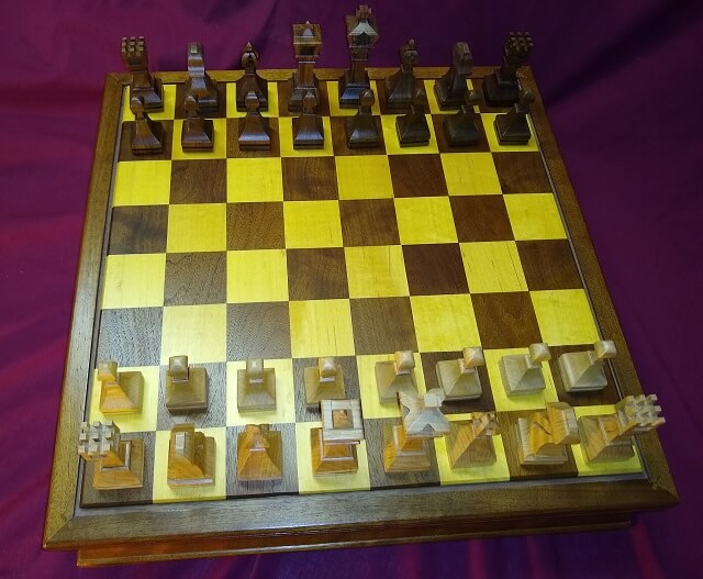 The completed chess pieces, sitting on the chess board I built.