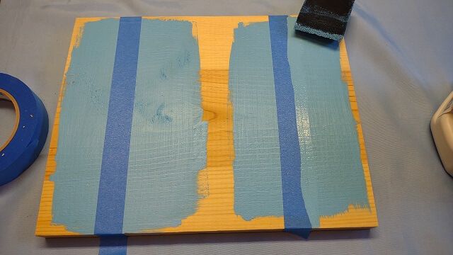 Another coat of the lighter colors applied to the right side of the sample.