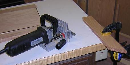 Cutting biscuit slots in the front miter joints.